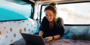 Sustainable passive Income systems passive income streams, digital products for passive income, build online income system, passive income for service providers, recurring income, long-term online income young woman in camper with laptop online business model, automated income, systemized income, digital revenue, knowledge-based earnings